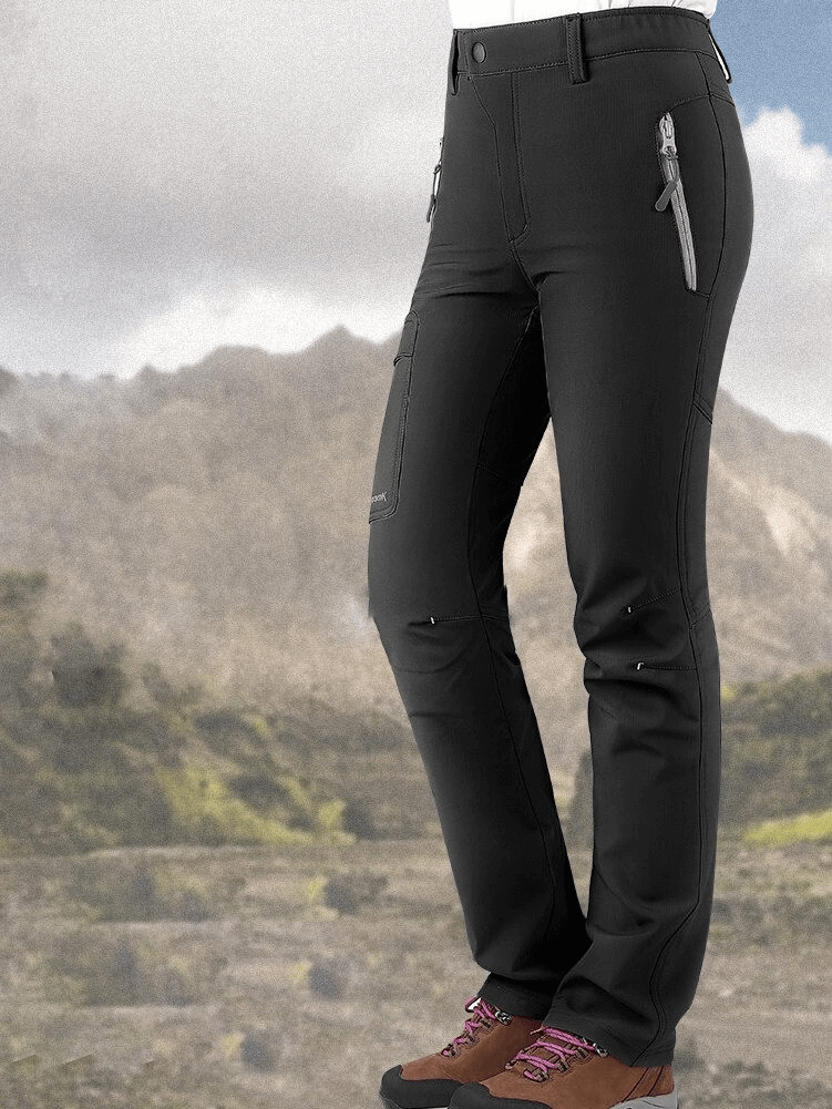 Women's hiking pants with windproof and elastic features, perfect for outdoor adventures. Made from polyester, nylon, and spandex.