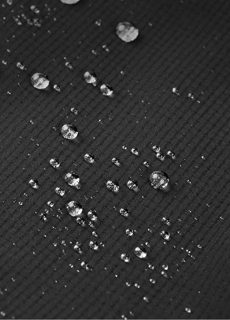 Close-up of water droplets on windproof fabric of women’s hiking pants