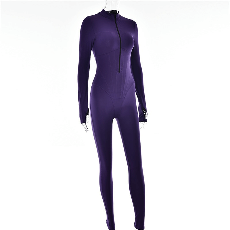 Purple sports female long sleeve jumpsuit with front zipper, made of stretchy polyester for comfort and style. Ideal for jogging.