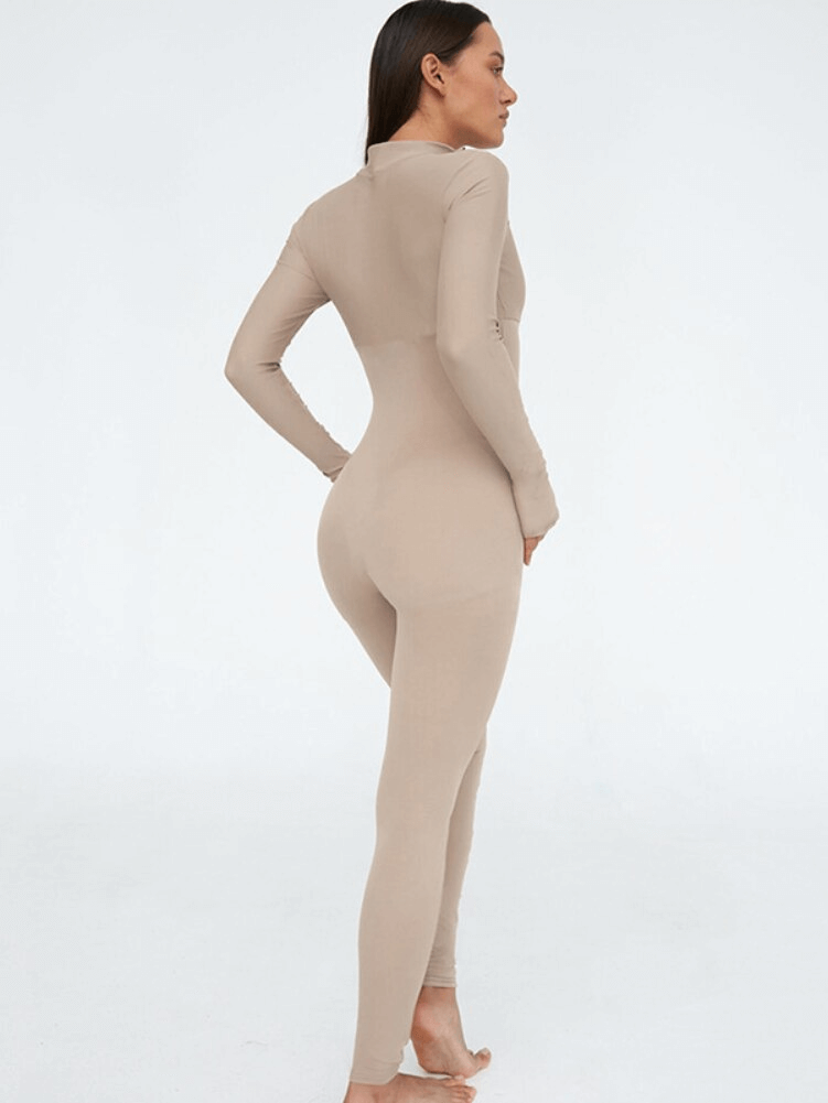 Female model in beige long sleeve jumpsuit with front zipper, sporty and stylish design for active wear - SF1061