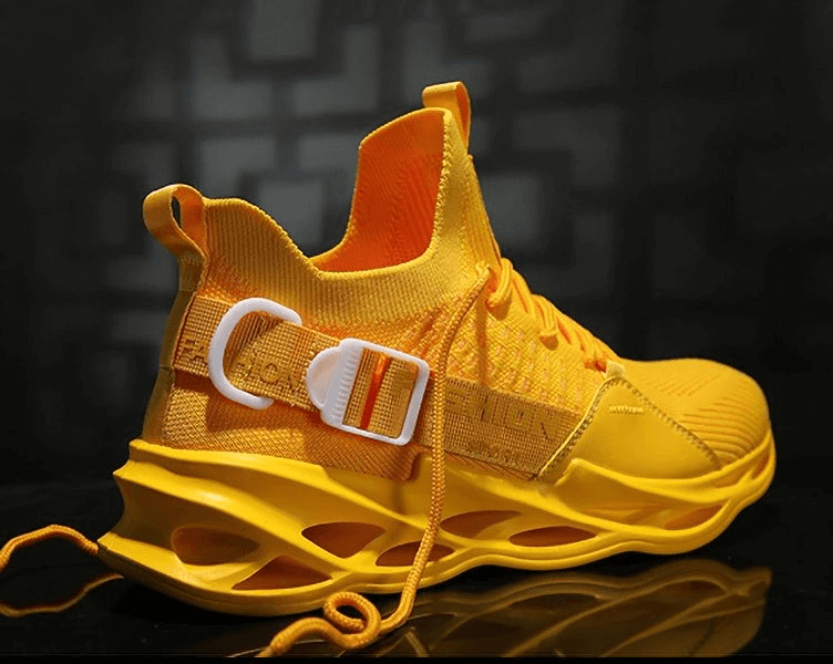 Bright yellow women's sports sneakers with breathable mesh and lightweight design, featuring a stylish buckle and unique sole pattern.