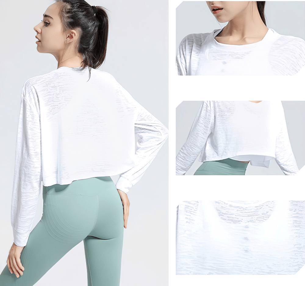 White long-sleeved loose fitness top for women, ideal for yoga and gym. Versatile, breathable, great for active wear, paired with green leggings.