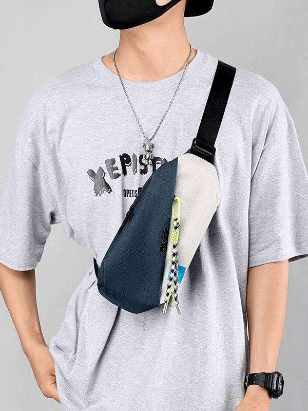 Stylish men's waterproof crossbody chest bag with removable tassel pendant and zipper closure, worn by a model in a casual outfit.