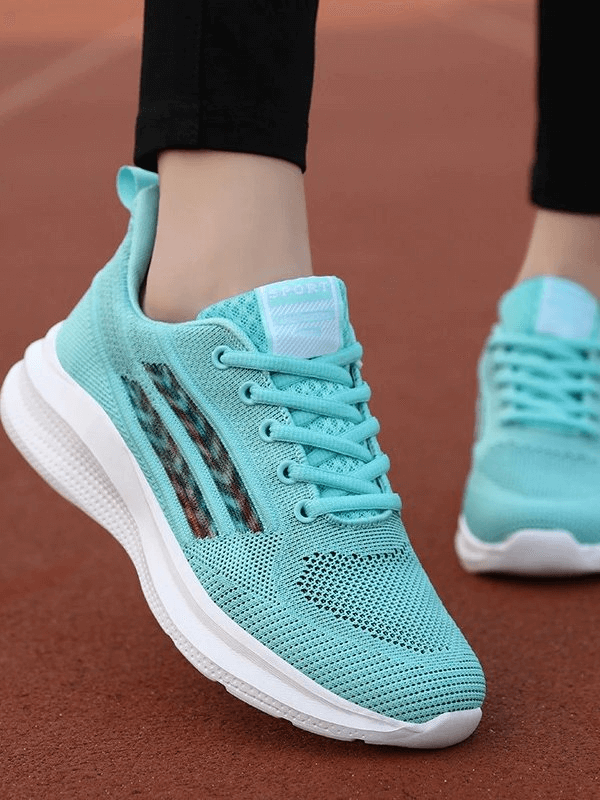 Turquoise women's breathable mesh training shoes with white sole, perfect for running and sports activities, featuring lace-up closure.