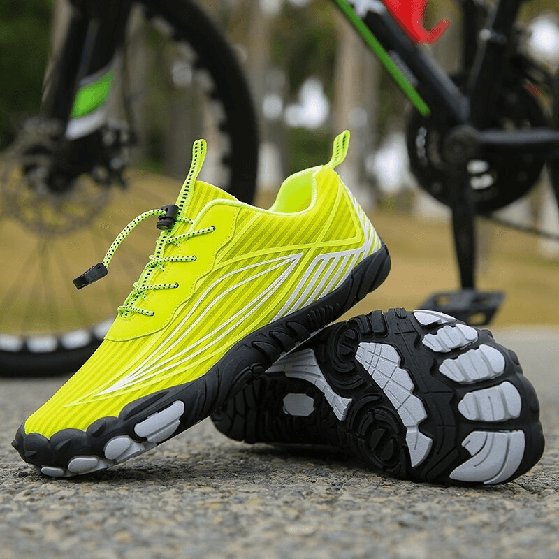 Vibrant yellow mountain bicycle sneakers with lightweight sole, perfect for outdoor adventures and cycling.