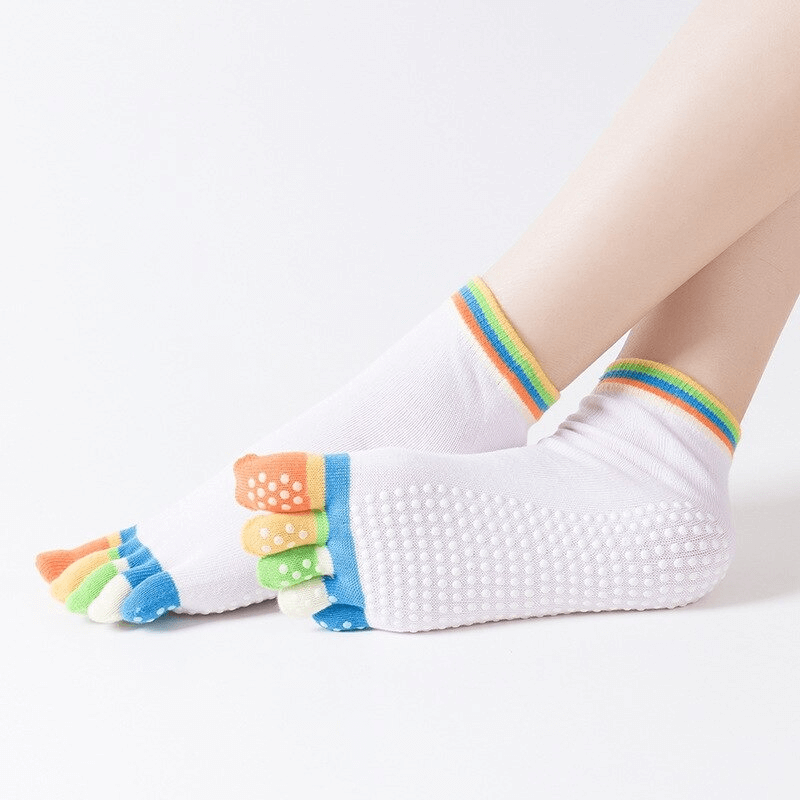 Colorful women's five-toe socks with non-slip soles, perfect for yoga and fitness, featuring quick-drying fabric.
