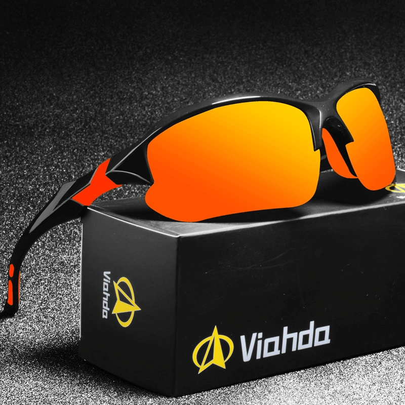 Sports polarized sunglasses with orange mirrored lenses on a Viahda box, ideal for cycling and driving, offering style and 100% UV protection.
