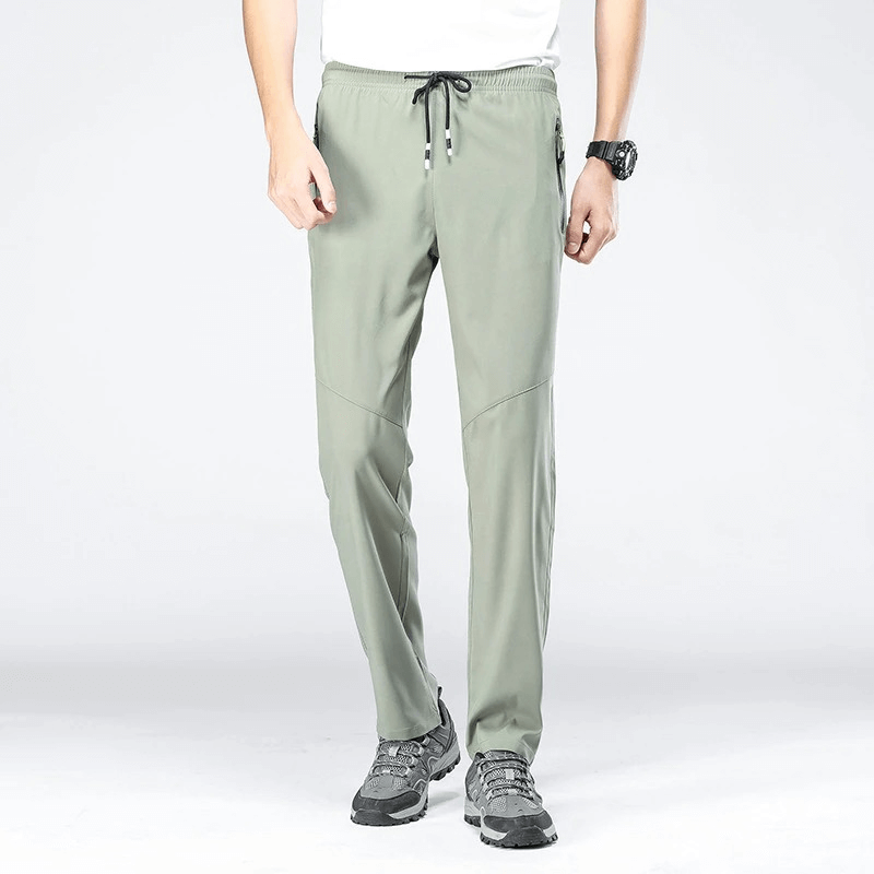 Sporty quick-drying men's pants with pockets in polyester, full length, elastic waist, perfect for hiking and camping.