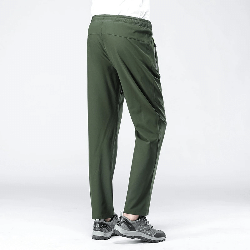 Back view of green quick-drying men's pants with pockets SF0228, showing full length and elastic waist designed for sports.