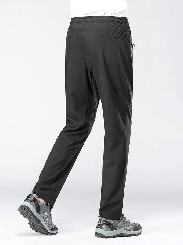 Back view of Sports Quick-Drying Men's Pants SF0228, showing elastic waist and breathable polyester material for hiking.