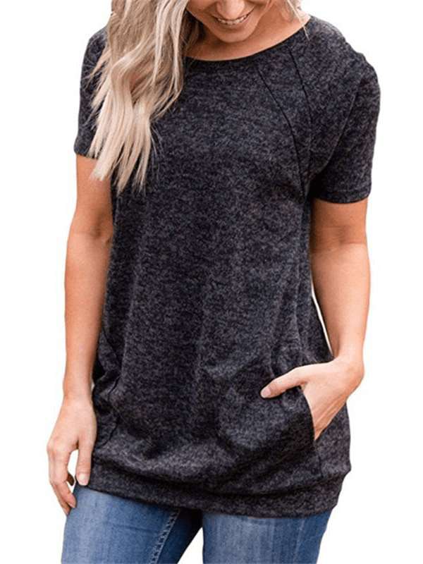 Woman wearing a black sports running loose t-shirt with pockets, short sleeves, and a round collar, perfect for workouts.
