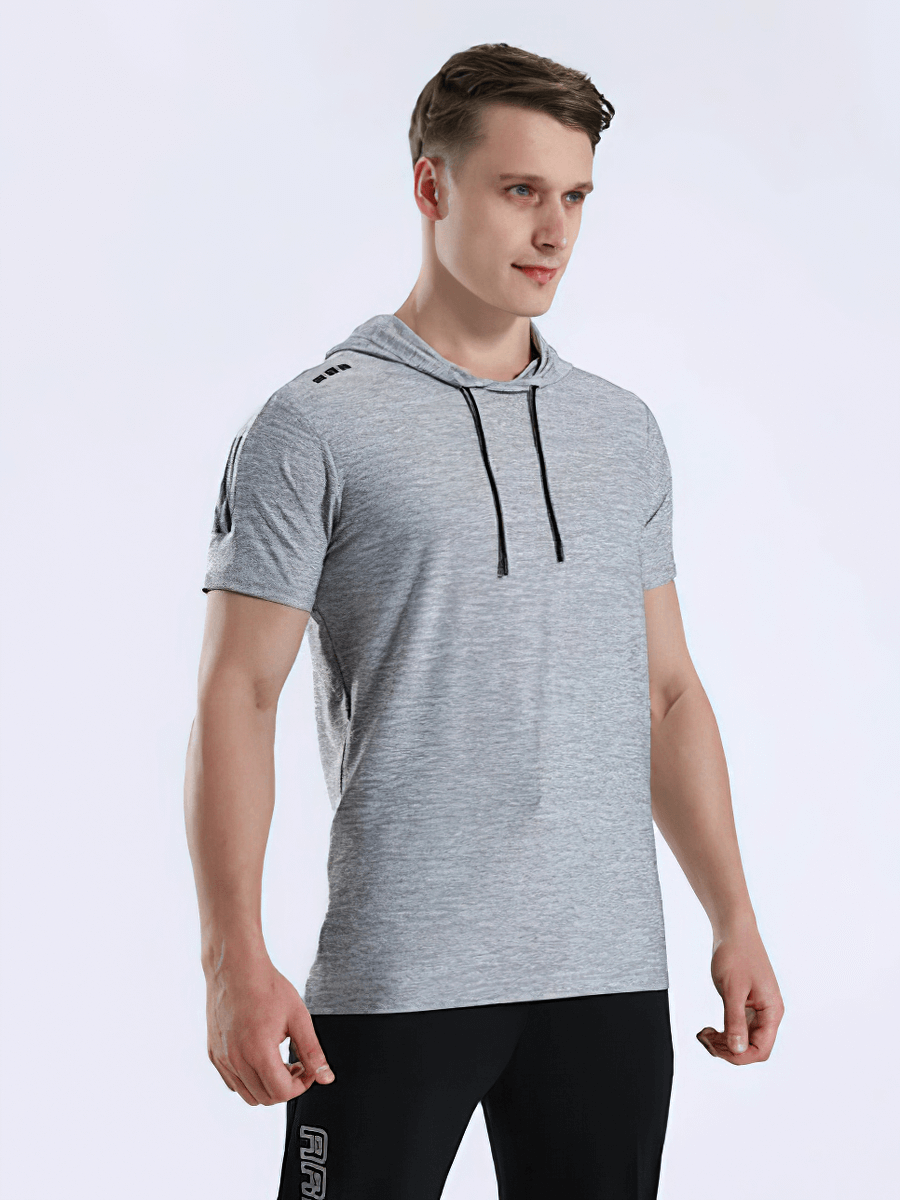 Man wearing gray sports running quick-dry t-shirt with hood, perfect for workouts and running. O-neck, breathable, high elasticity.