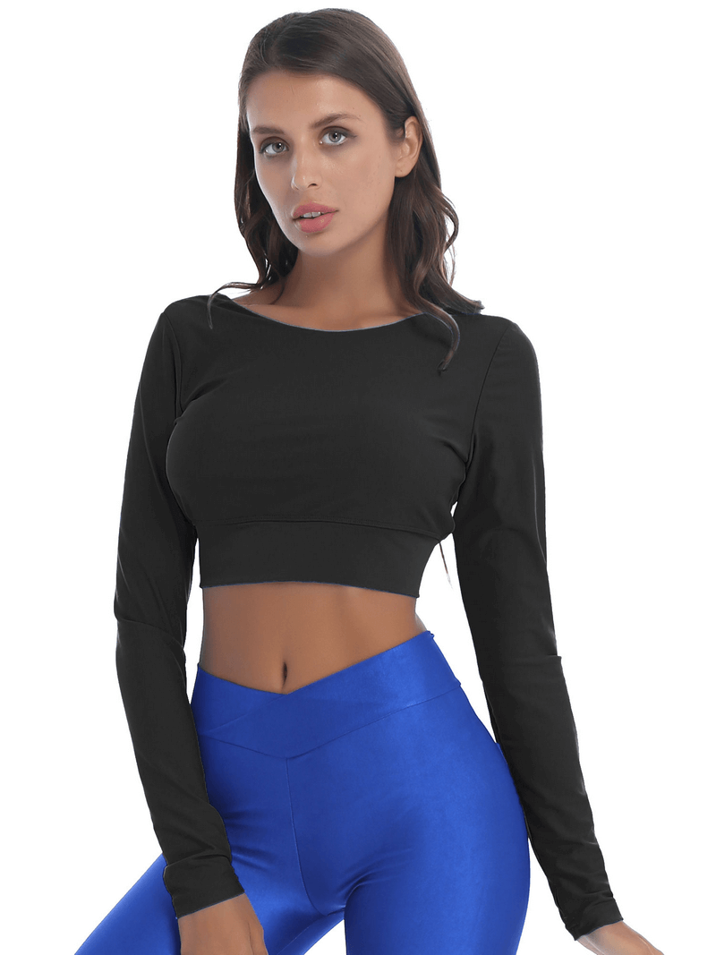 Model wearing black seamless long sleeves cropped top with back cross strappy, paired with blue leggings.