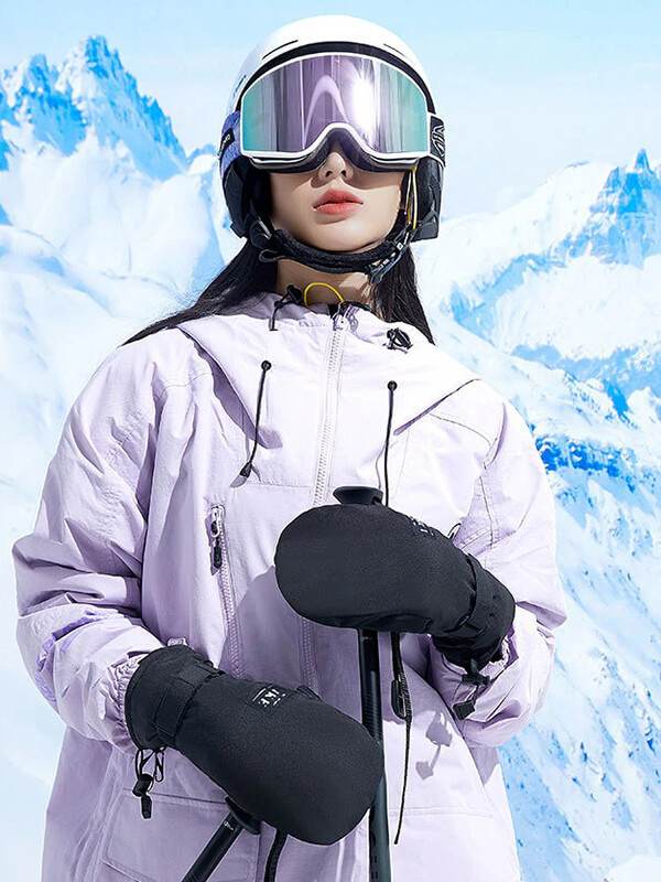 Unisex sports skiing gloves with touch screen capability, worn by a skier in the mountains, ensuring warmth and device use.