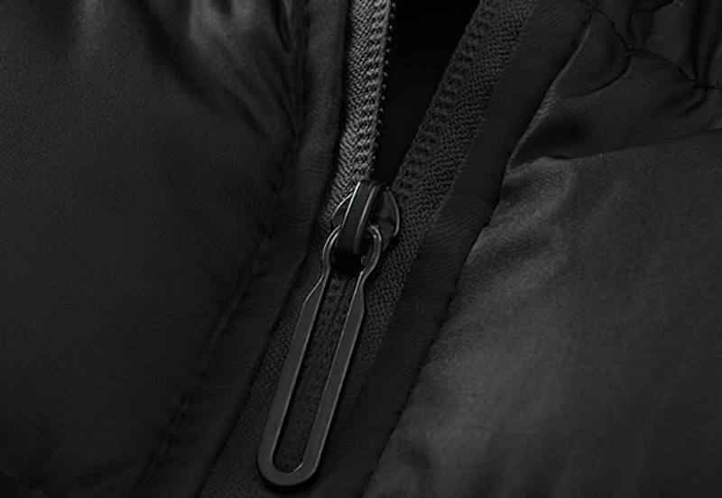Close-up of zipper on windproof football sleeveless jacket, showcasing durable cotton-polyester fabric and secure closure.