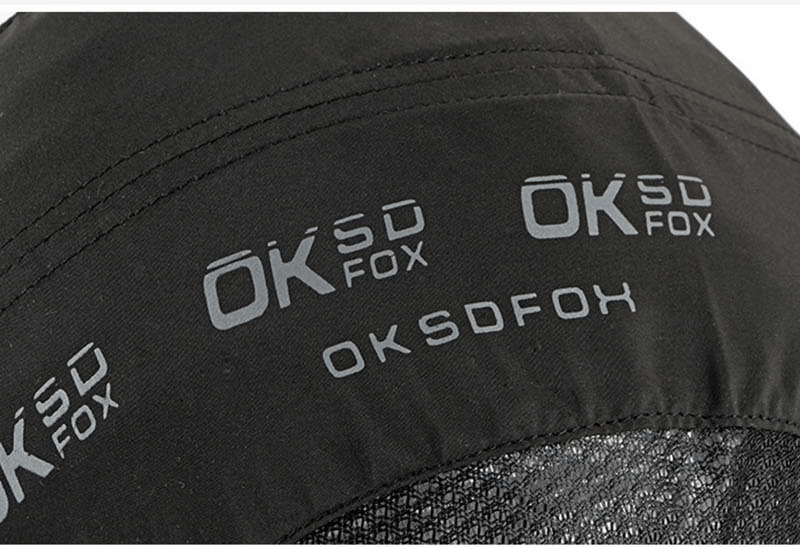Close-up of black breathable baseball cap with OKSDFOX logo, showing detailed stitching and mesh for ventilation, perfect for outdoor sports.