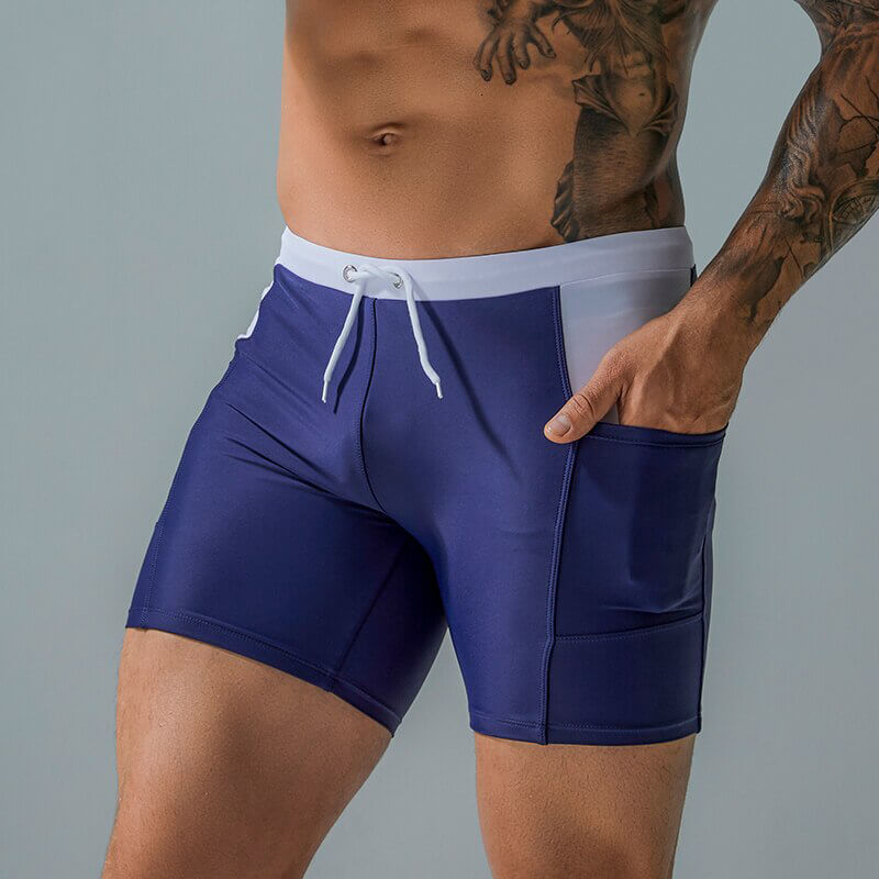 Men's waterproof beach boxer shorts with drawstring and pockets, perfect for sporty beach activities.