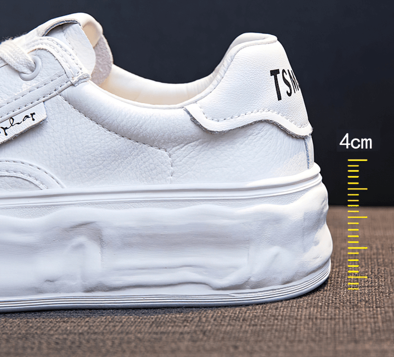 Close-up of white women's sneaker with thick 4cm sole, lace-up design, mixed colors, and superior comfort.