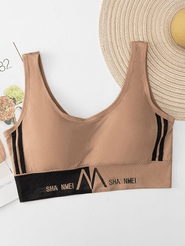 Beige seamless sports bra for women with lining. Ideal for jogging, yoga, gym workouts. Anti-friction, breathable, quick dry.