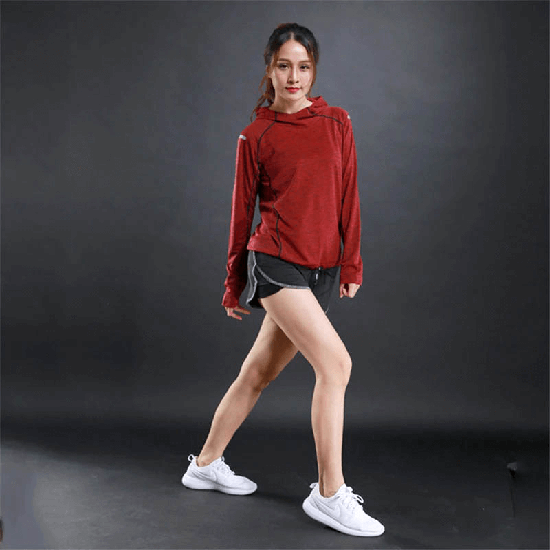 Sports women's thin long sleeves red hoodie with reflective printing, perfect for gym fitness and running comfort. Model demonstrating athletic wear.