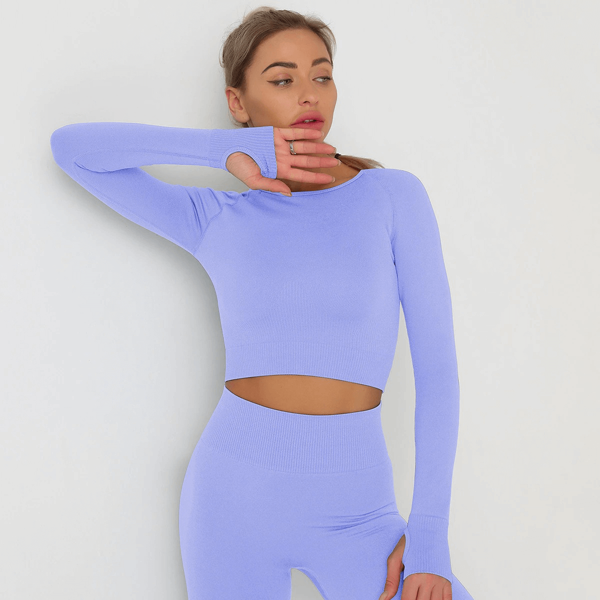 Fashionable women's long sleeve crop top in lavender, ideal for yoga and running, featuring quick dry and anti-pilling technology.