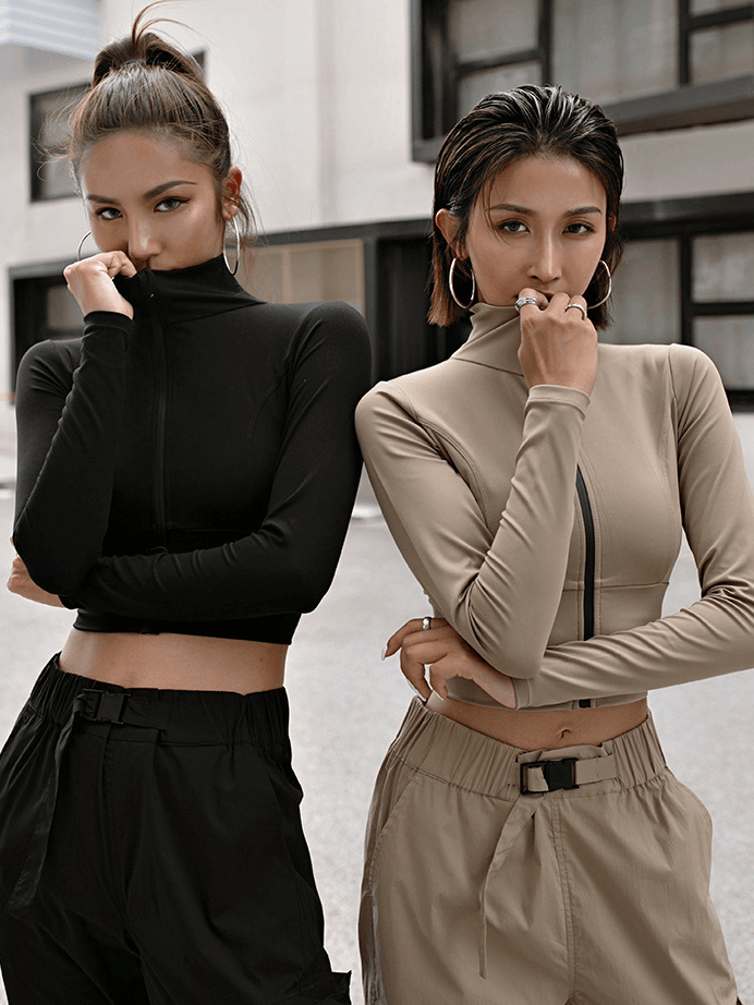 Two women wearing Sports Women's Zipper Elasticity Jackets in black and khaki, stylish activewear for running and fitness.