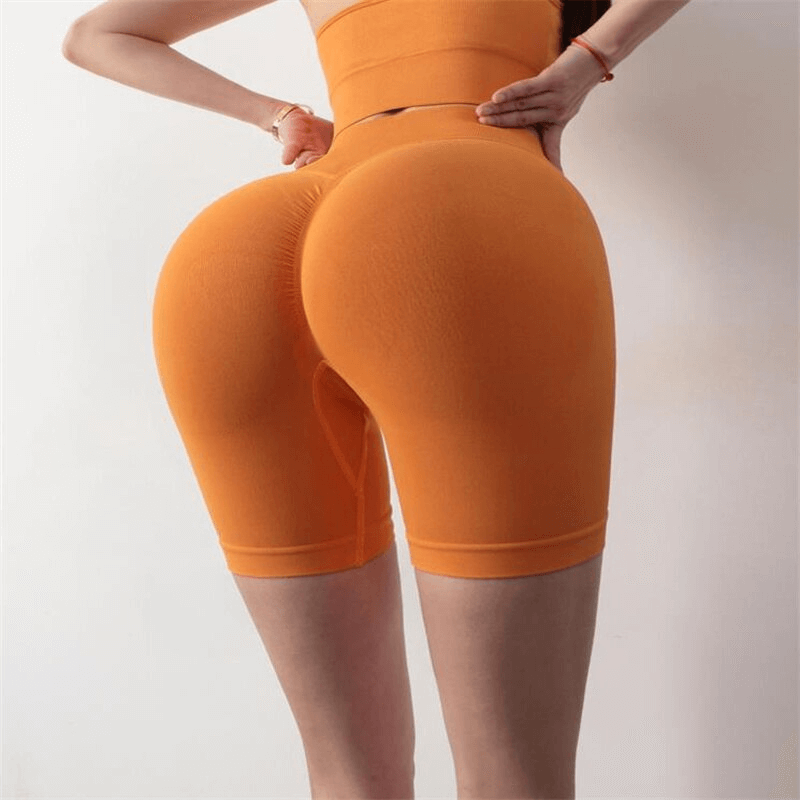 Sporty Elastic Quick-Drying Women's Shorts in vibrant orange, perfect for yoga and intense workouts, crafted with breathable Lycra fabric.