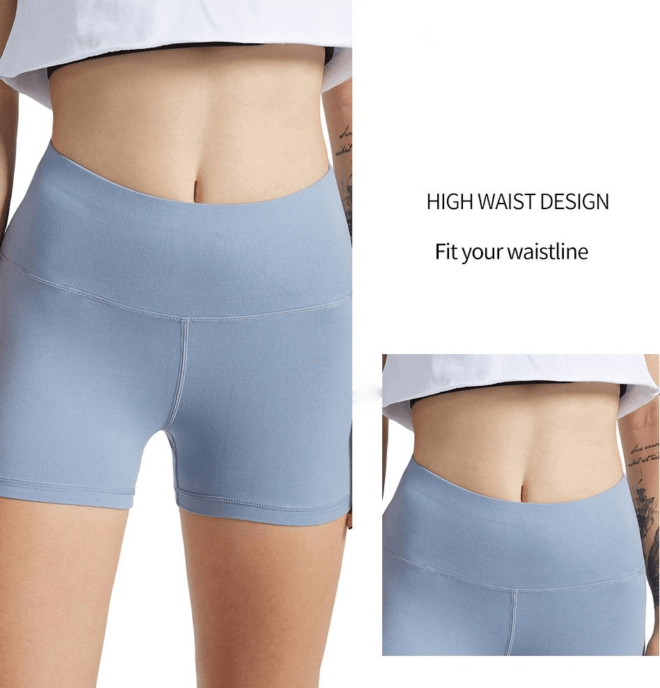 Sporty Elastic Women's Short Shorts - High Waist Design, Blue. Perfect for Training and Fitness. Model wearing stretchy shorts.