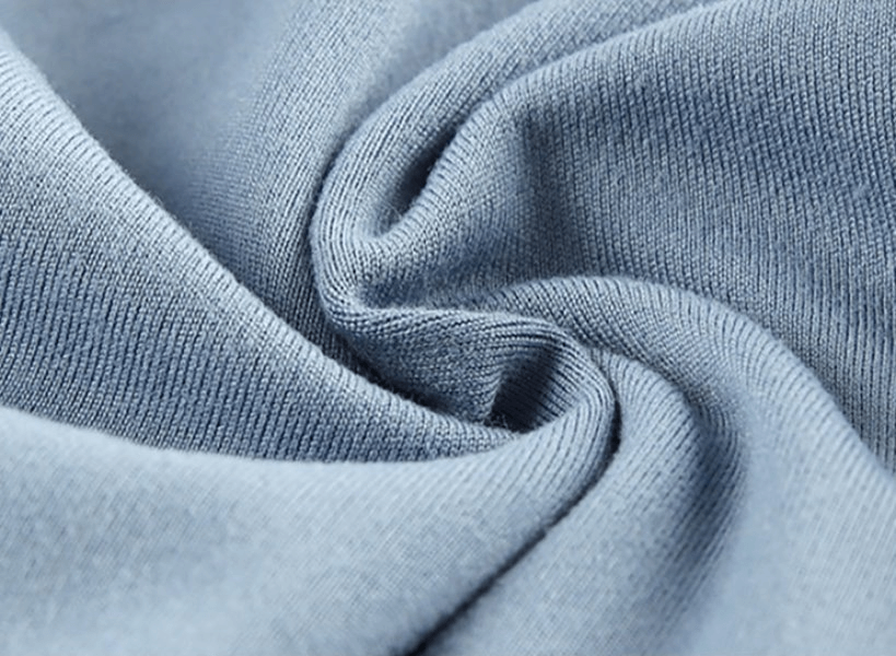 Close-up of soft, blue polyester-spandex fabric for Sporty Elastic Women's Short Shorts, highlighting smooth texture and quality.