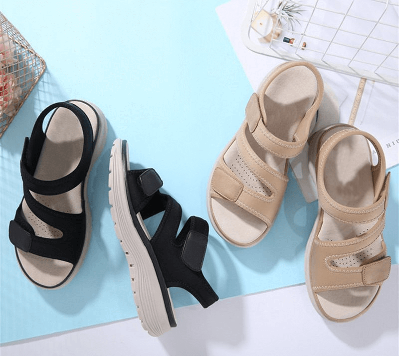 Sporty flexible women's open-toe flat sandals with fasteners in black and beige, featuring a comfy platform and modern design.