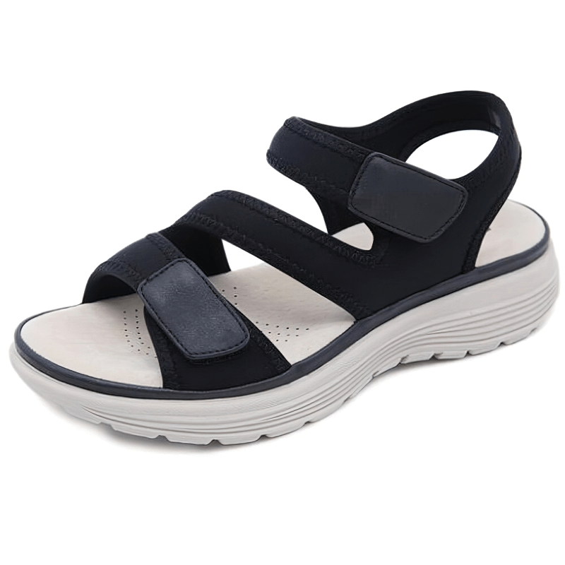 Sporty flexible women's open-toe flat sandal with fasteners and 3cm platform, black with secure straps on a white background.