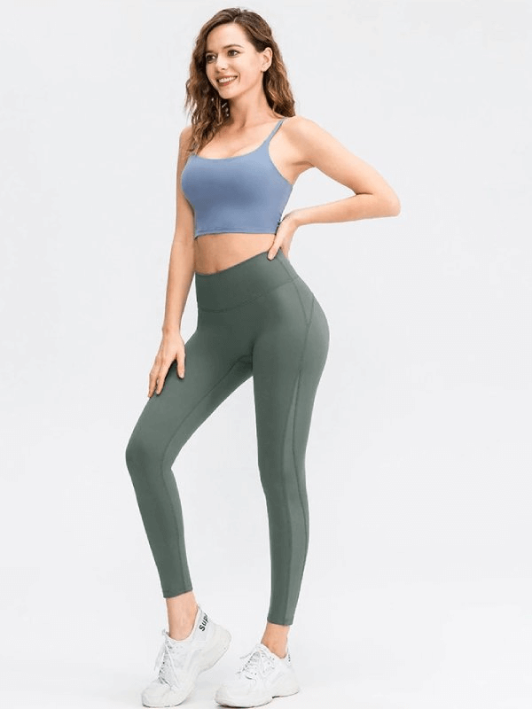 Woman wearing Sporty Seamless Women's Leggings with High Waist and blue top, showcasing comfort and flexibility for yoga or exercise.