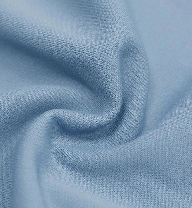 Close-up of soft blue fabric texture, perfect for sporty seamless women's leggings, showcasing comfort and flexibility for yoga routines.
