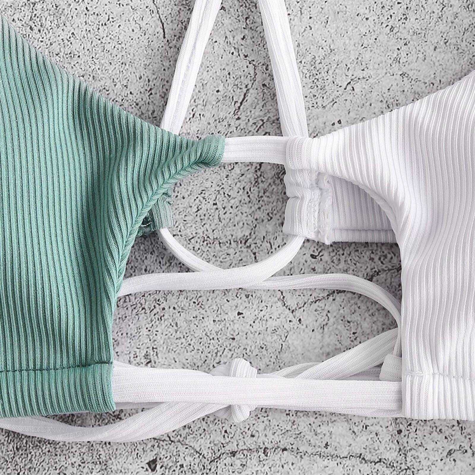 Green and white string bikini tops showcasing elegant patchwork design, perfect for stylish beachwear.