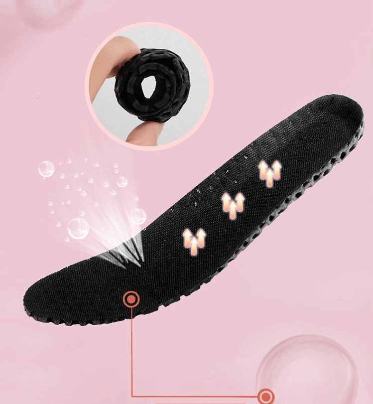 Black EVA insole showcasing breathable material and flexible design of women's sneakers against a pink background.