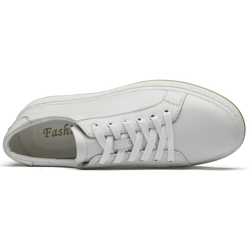 Alt Tag: Top view of white breathable genuine leather men's shoe with lace-up closure and rubber outsole for style and comfort.