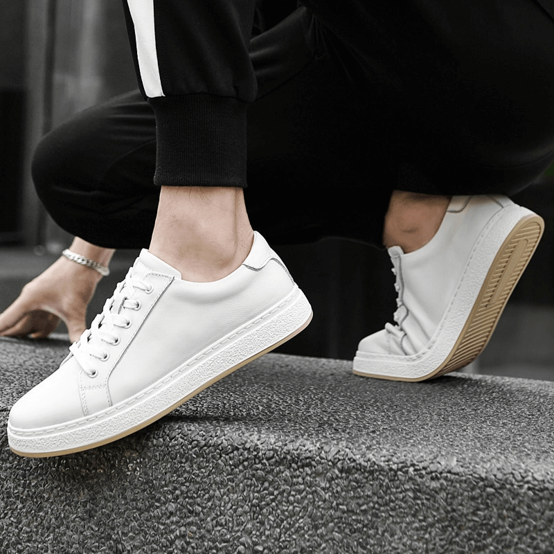 Person wearing stylish breathable genuine leather men's shoes SF1170, featuring a solid pattern and rubber outsole for superior traction.