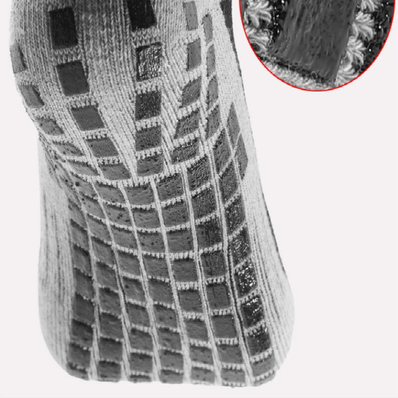 Close-up of stylish breathable non-slip sports sock with silicone sole in grid pattern, ideal for unisex football players.