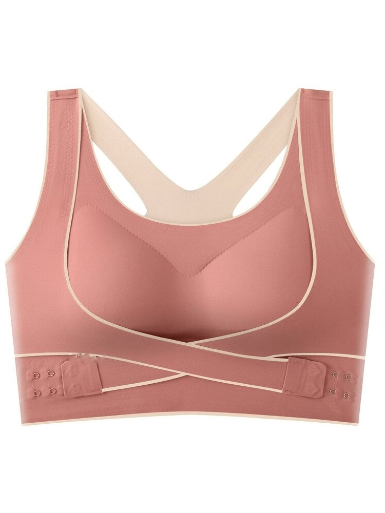 Stylish elastic cross back push-up sports bra with front closure in pink. Features breathable, anti-sweat fabric and shockproof pads.