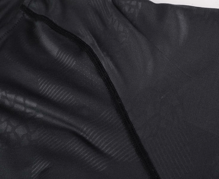 Close-up of black polyester and spandex blend fabric from a Stylish Elastic Sports Men's Hoodie, showcasing the breathable texture.