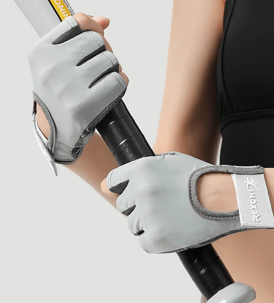 Woman wearing stylish elastic fingerless gloves gripping a handlebar, ideal for female cyclists and training sessions.