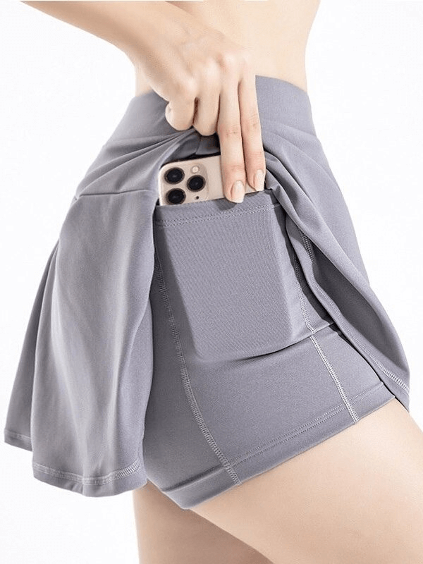 Stylish elastic women's tennis shorts-skirt with pocket, lightweight polyester, gray color, ideal for performance and comfort.