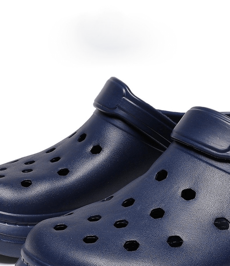 Close-up of blue unisex lightweight Crocs with ventilation holes, perfect for casual wear. Stylish, comfortable, and slip-on design.