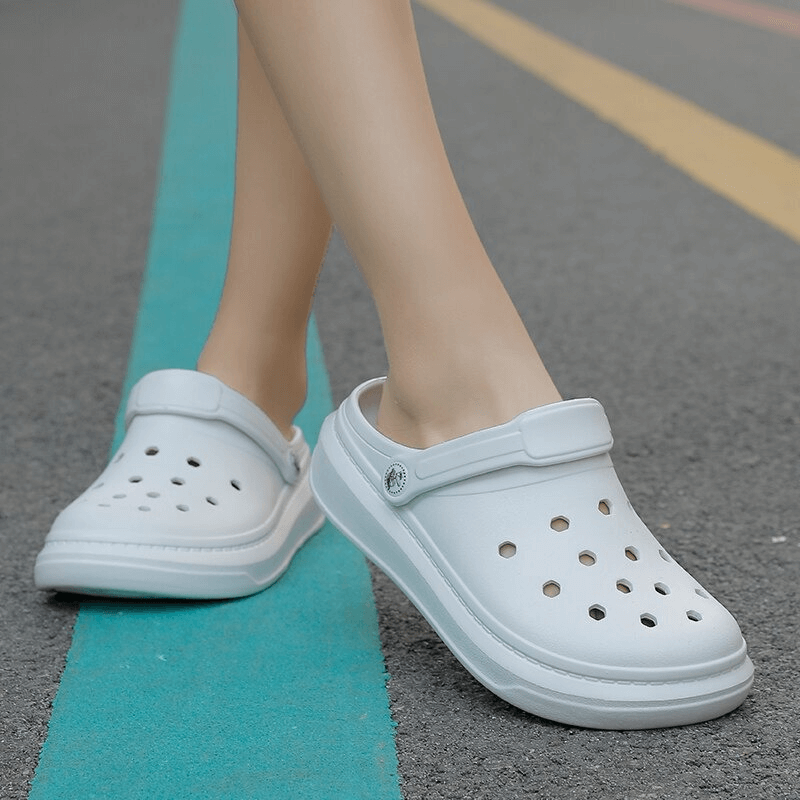 Unisex lightweight white Crocs SF0281 with strap, stylish and comfortable for casual wear.