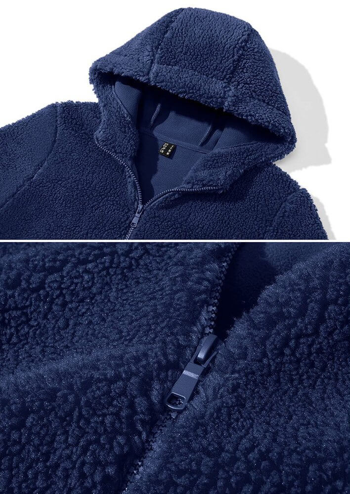 Stylish fluffy women's jacket with hood and zipper in navy blue, warm polyester material, close-up of fabric texture, product code SF0905.