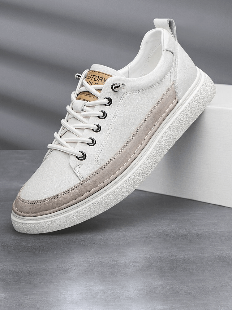 Stylish white leather men’s sneakers SF1182 with lace-up closure and rubber sole on display.