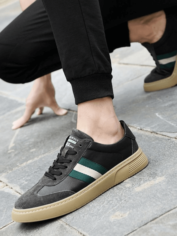Men's stylish leather sports shoes in black with green and white stripes, featuring a durable rubber sole, model SF1176.