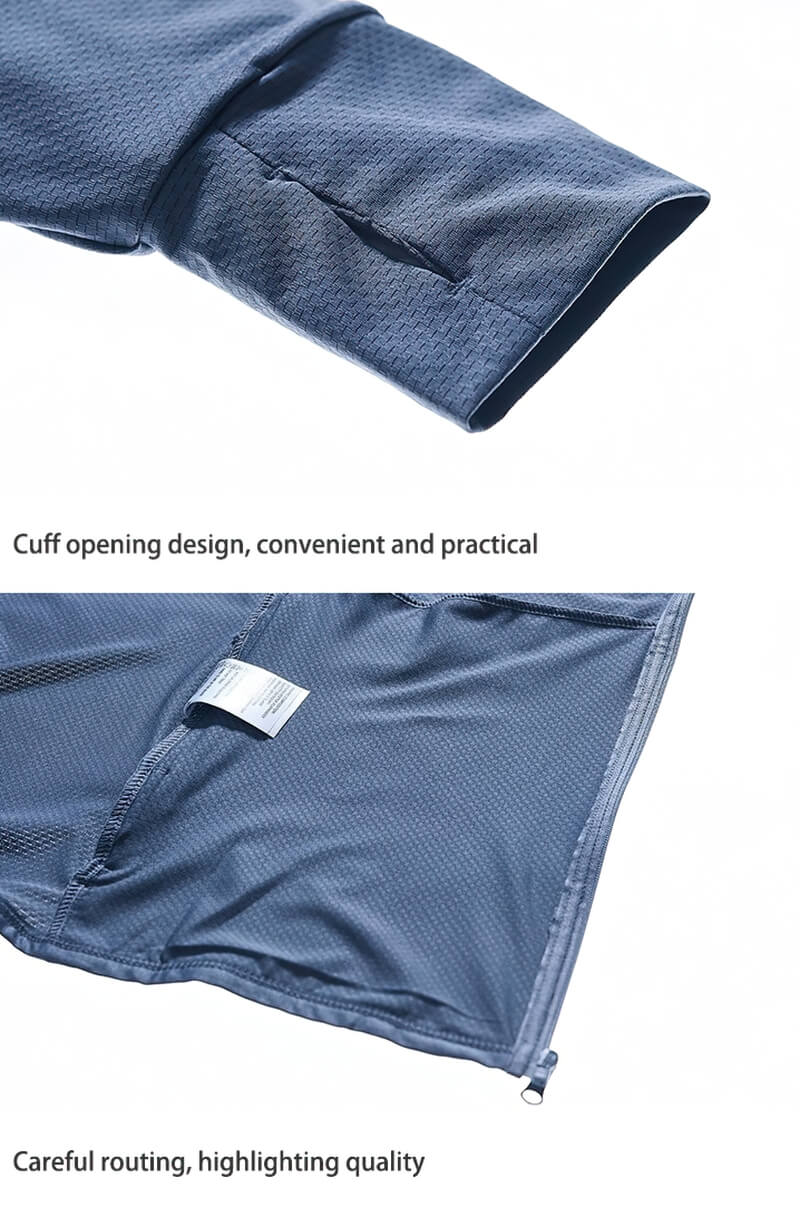 Close-up of blue windbreaker with thumb holes showcasing cuff and interior lining, highlighting practical design and quality craftsmanship.