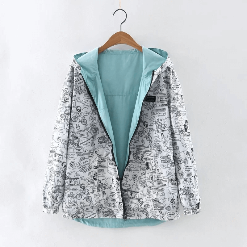 Stylish lightweight reversible women's windbreaker jacket with hood and pockets, featuring a playful print, model SF0941.