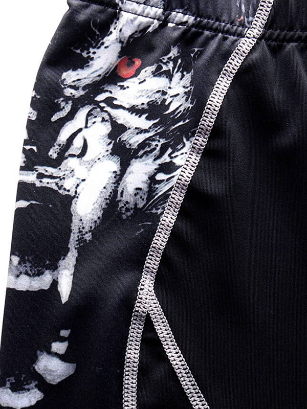 Close-up of stylish long sleeve compression sports top for men, featuring black and white graphic design and stitch detail.